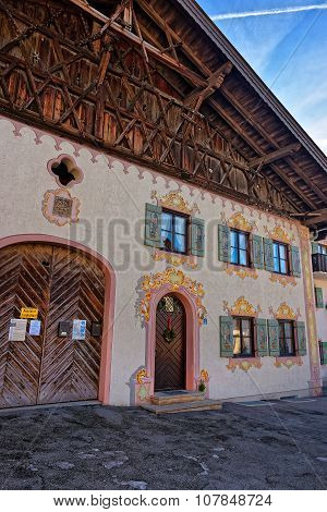 Garmisch-Partenkirchen, Germany - January 7, 2015: Charming houses with decoratively painted facades of Garmisch-Partenkirchen. Bavaria. Germany