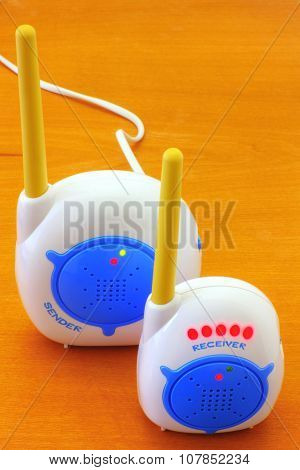 Babyphone on wooden background closeup