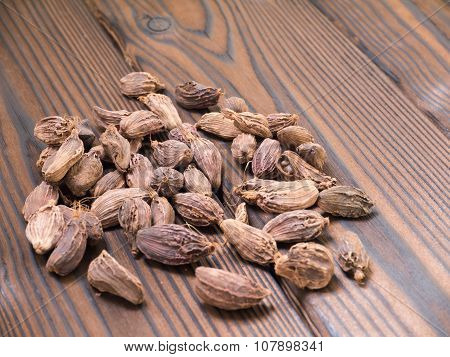 Amomum Pods On The Dark Wooden Textured Planks