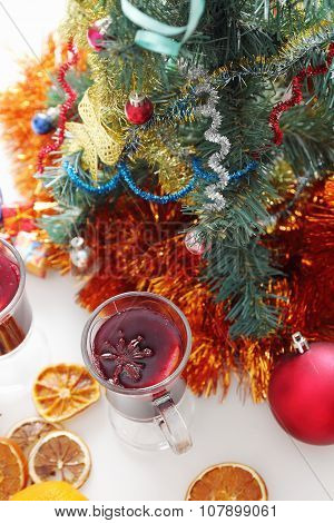 mulled wine with decorated christmas tree