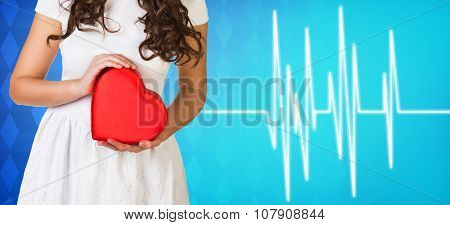 Woman present heartbox beside pulse line