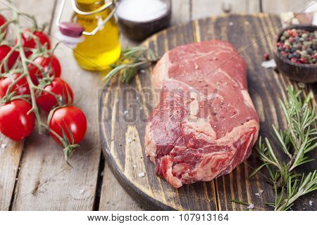 Grilled sliced barbecue pork ribs with cabbage salad cole slaw in a plate on a wooden background