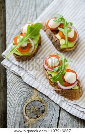 Avocado mozzarella and tomato bruscetta