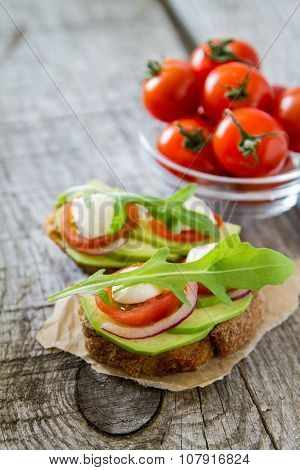 Avocado mozzarella and tomato bruscetta