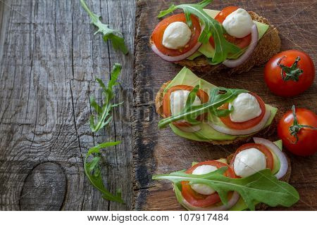 Avocado mozzarella and tomato bruscetta