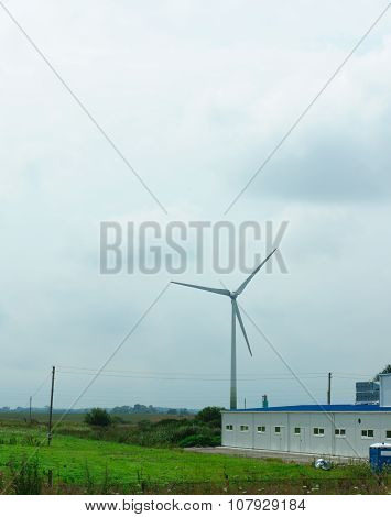 Wind-driven Generator In The Middle Of A Field