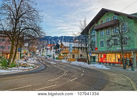 GARMISCH-PARTENKIRCHEN GERMANY - JANUARY 06 2015: Beautiful Alpine town of Garmisch-Partenkirchen with colorful houses and snow-covered mountains in the background