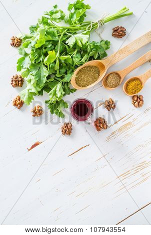 Georgian sauce ingredients on white wood background