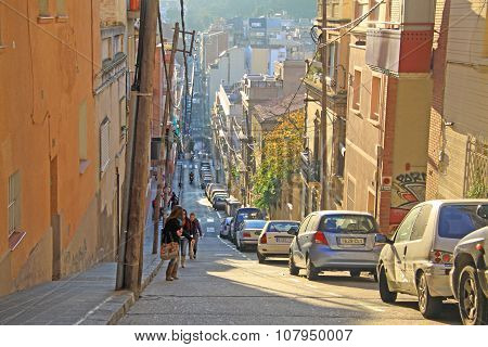 Barcelona, Catalonia, Spain - December 12, 2011: Road To Park Guell In Barcelona With Parked Cars