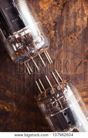 50's 60's Vacuum tube on rustic wood. Shallow depth of field. 
