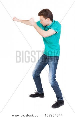 back view of skinny guy funny fights waving his arms and legs. Isolated over white background. Rear view people collection.  backside view of person. Funny guy clumsily boxing. 