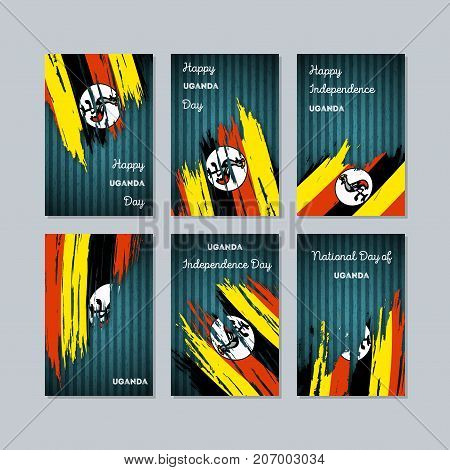 Uganda Patriotic Cards For National Day. Expressive Brush Stroke In National Flag Colors On Dark Str