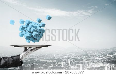 Cropped image of waiter's hand in white glove presenting multiple cubes on metal tray with cityscape view on background. 3D rendering.