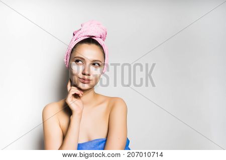 girl after shower coquettish looking away, isolated on white background