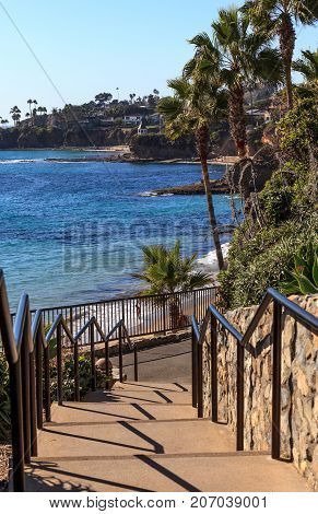 Steps leading down to Heisler Park above the ocean in Laguna Beach California in fall.