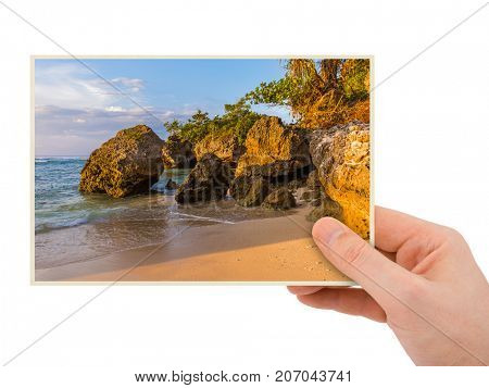 Hand and Padang Padang Beach in Bali Indonesia (my photo) isolated on white background