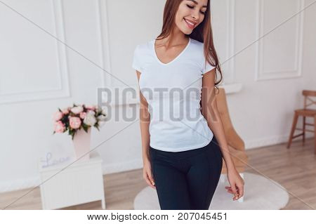 Woman with a big breast in a white T-shirt. Mock-up.