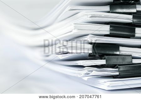 extreamly close up stacking of office working document with paper clip folder