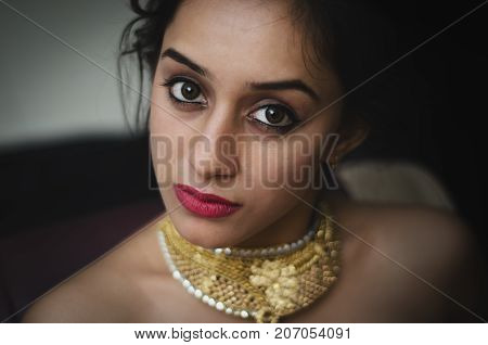 Concept Shoot With A Model Wearing A Jewellery Gold Neckpiece At A Studio