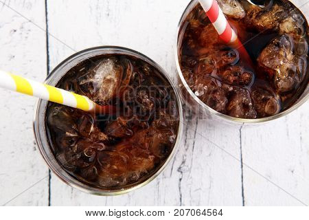 Softdrink With Ice Cubes, Lemon And Straw In Glass
