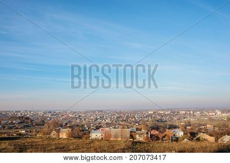 View On The Beautiful Colorful Autumn Landscape With A Small Village That Consists Of Houses