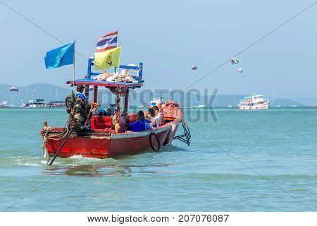 Pattaya, Chonburi Province, Thailand. - NOVEMBER 1, 2015 : Fishing boat or Transport boat for send people or traveller to koh lan at sea of Pataya beach.