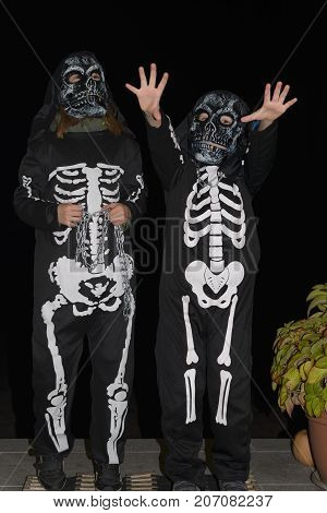 Happy Brother And Two Sisters On Halloween.