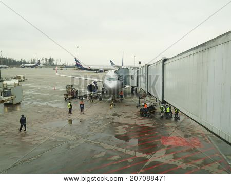 Moscow Russian Federation - March 16 2017: Big traffic of passengers airliners and service cars ride at airdrome in Sheremetyevo.