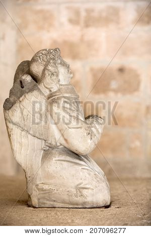 MONTMAJOUR FRANCE - JUNE 26 2017: Statue of angel in the cloisters of the Abbey of Montmajour near Arles France