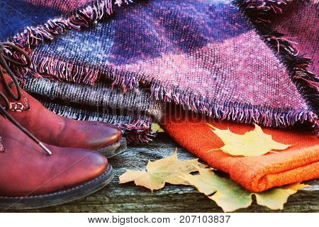 Fall Fashion Woman Clothes Set. Design.Trendy Cozy Sweater. Fashion Stylish Glamour Shoes. Yellow Fall Leaves on wooden background.