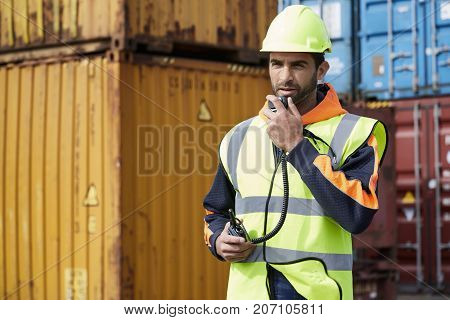 Hardhat guy working as docker on radio