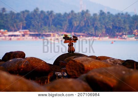 Japanese rock garden on Palolem beach in Goa, India. Zen (dzen) stones. Indian nature. Meditation and relax place on the beach.