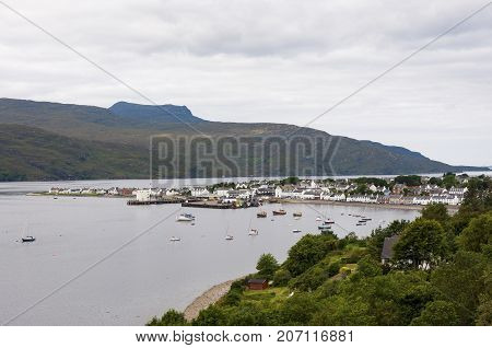 Ullapool Scotland - August 15 2010: View of the fishing port and the village of Ullapool in the Highlands in Scotland United Kingdom