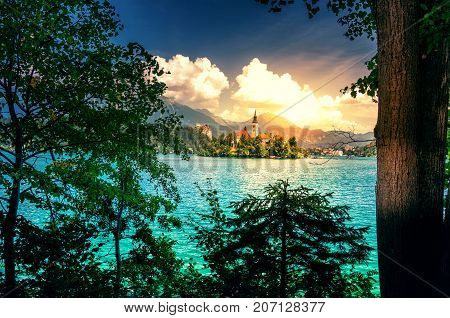 Summer scene in the park of Bled lake with medieval castle Blejski grad, Slovenia.