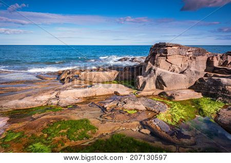 Rumbling Kern Rock Pool, near Howick on the Northumberland coastline, lies a small beach and cove sheltered by small cliffs