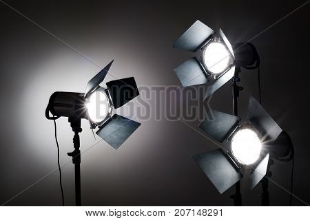 Several reflectors on the black background in photo studio. ready to do professional shooting