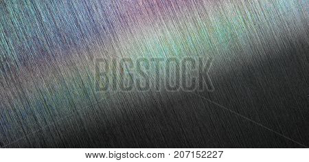 Brushed metal or hairline metal in dim light.  With rainbow sheen or reflection.  Wide format.