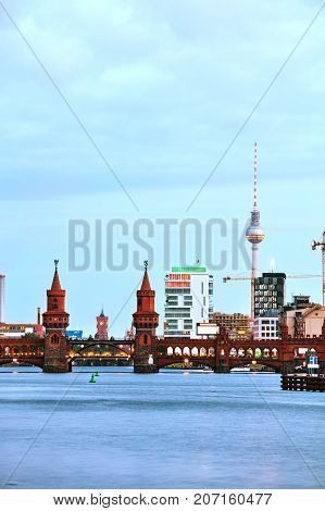 Berlin cityscape with Oberbaum bridge in the evening