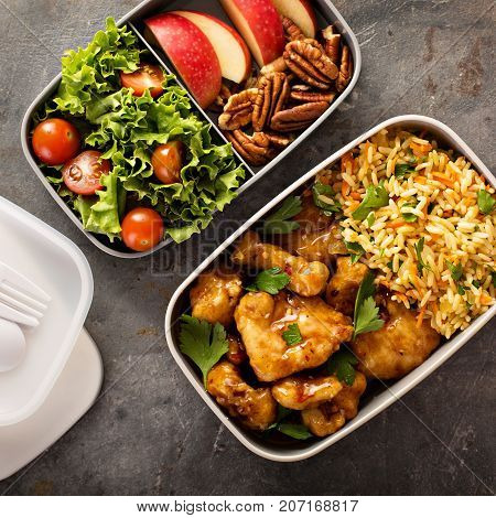 Lunch boxes with food ready to go for work or school, ahead meal preparation or dieting concept