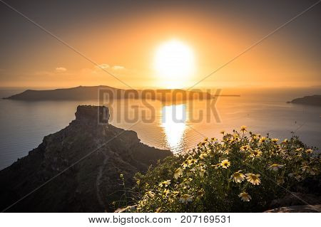 Amazing sunset on the Skaros rock at Imerovigli, Santorini, Crete, Greece.