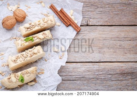 Tasty Slices Of Halva With Walnut And Cinnamon On Pergament