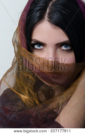 woman in hijab with sexy blue eyes