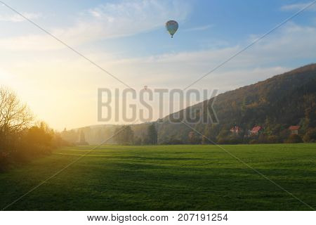 Balloon over field. Rural scenic. Czech Republic.