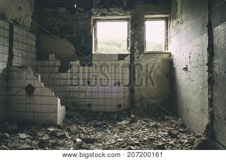 abandoned building urban exploration Sun rays falling down on the flor in old forsaken house. Urbex of spooky and scary old factory. Faded photo of Ancient ruins with destroyed bricks