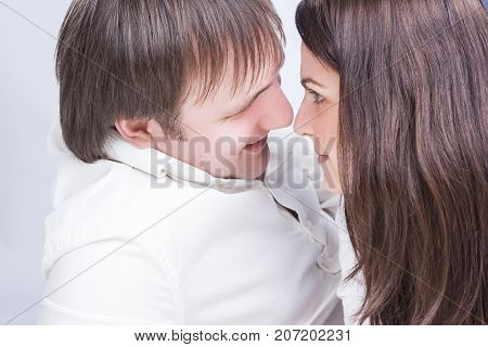 Cute Caucasian Couple Having an Interaction with Each Other While Looking Eyes To Eyes. Horizontal Image