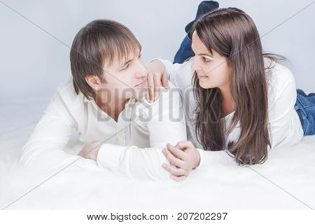 Cute Caucasian Couple Communicating Together. Embracing and Looking into Each Other Eyes with .Holding Hands In Touch. Horizontal Image Composition