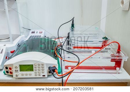 Table with equipment for gel electrophoresis at Biochemical laboratory