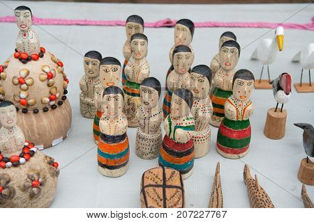 Boca de valeria Brazil - December 03 2015: souvenirs of wooden figurines birds and animals on white tablecloth background. Presents and gifts. Travel and tourism concept.
