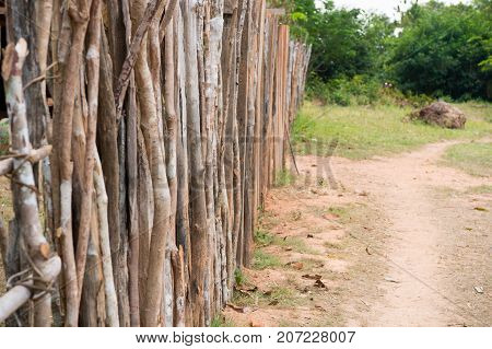 Palisade or fence in countryside on natural background in boca de valeria brazil. Poverty construction lifestyle concept