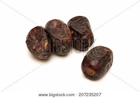 Fresh sweet dates on white background, close up
